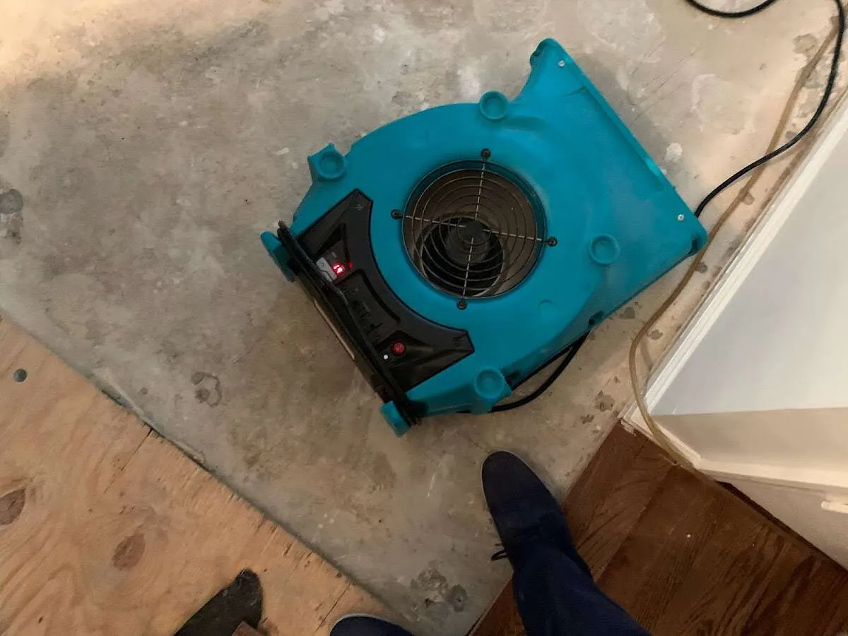 Air mover drying subfloor during Leak Detection & Repair in San Mateo